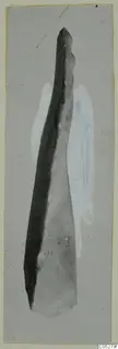 Long tapering find with a pointed upper end, photographed on a grey card from Kythrea