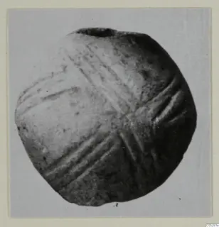 Round object with several sets of crossing incised grooves, a small find from Lapithos