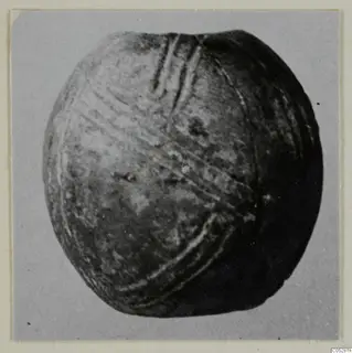 Rounded find with incised grooves, from the Vrysi tou Barba tombs at Lapithos