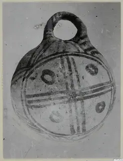White Painted III-2 pottery vessel from Lapithos, with a loop handle and cross-banded painted decoration