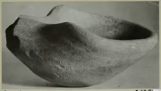 Terracotta lamp from Enkomi, shown from the side against a plain background