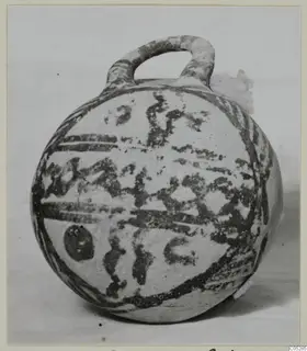 Round pottery vessel with a loop handle and dark painted bands, White Painted III-2, from Lapithos