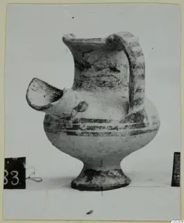 Pottery White Painted II spouted vessel from Lapithos, Kastros tombs, with a strap handle and painted bands