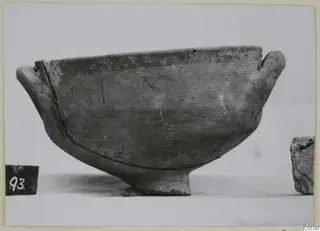 Two-handled bowl on a short foot, photographed against a plain background.