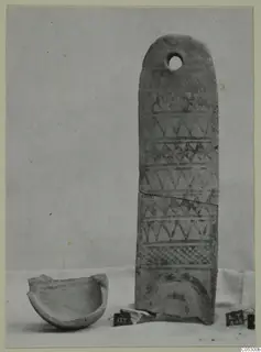 Pottery White Painted III-1 with a hole near its rounded top, shown beside a broken bowl