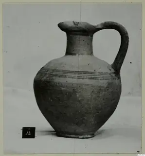 White Painted III-1 pottery jug with a single strap handle and thin painted bands on the body