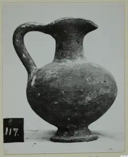 Grey polished ware jug with a strap handle, from the Kastros tombs at Lapithos