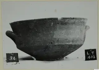 Pottery bowl with two small handles and a repaired crack, shown with number labels, from Lapithos