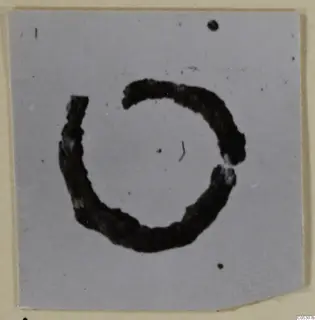 Open ring of bronze personal adornment from the Kastros tombs at Lapithos, photographed on a mount