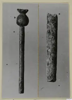 Two small find objects from the Kastros tombs at Lapithos: a pin with a knobbed head and grooved shaft, and a short rough rod