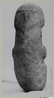 Front view of a stone idol from Petra tou Limniti, standing upright on a pale background.