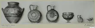 Row of painted pottery vessels from Stylli, Tomb 11, photographed side by side on a mounted card.