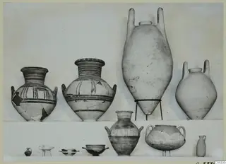 Pottery jars and small vessels from Marion, Tombs 96 and 8, set out for photographing in two rows.