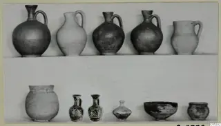 Pottery from Tomb 32 at Marion: jugs, jars, small painted vessels and a bowl arranged on a light background