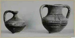 Juglet and amphoriskos from Tomb 7 at Marion, standing side by side against a plain background.