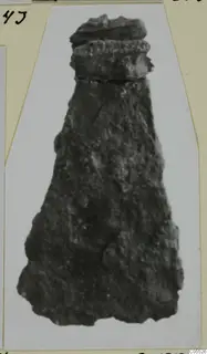 Corroded iron tool from Marion Tomb 36, shown on a mounted photograph card