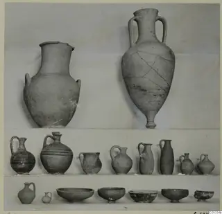 Pottery from Marion, Tomb 31: two large jars at top, a row of jugs and juglets in the middle, and bowls and small jugs along the bottom.