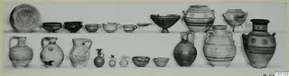Two rows of pottery vessels from Tomb 75 at Marion: jugs, jars, bowls, cups and a plate
