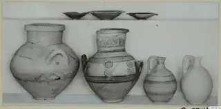 Four pots and three shallow bowls from Tomb 78 at Marion, some with painted circles and bands
