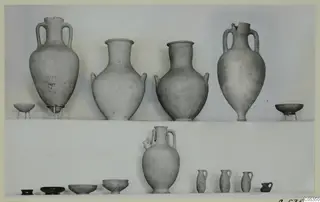 Pottery from Marion, Tomb 91: jars, bowls and small juglets set out in two rows.