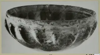Glass bowl with vertical ribs from Marion, Tomb 9, shown on a photo mount