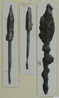 Three photographs of metal weapon heads from Marion tombs, mounted side by side on card.