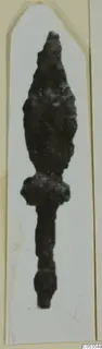 Corroded iron arrowhead with a pointed blade and narrow tang, from the Marion tombs 31–45 finds