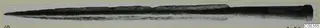 Long bronze blade with a pointed tip and a hilted tang, photographed horizontally against a pale ground.