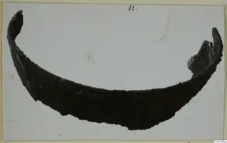 Curved sherd of a bowl from Marion against a pale background