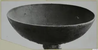 Bronze bowl from Marion Tomb 73, photographed at an angle from above.