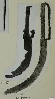 Blade and handle from Marion: two corroded metal objects, cut out and mounted on a card.