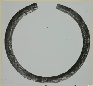 Open metal ring with tapering ends, from Marion, Tomb 62.