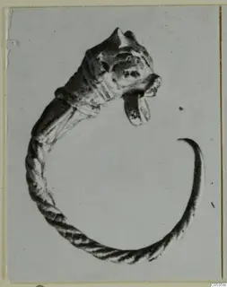 Twisted bracelet ending in an animal head, from Marion