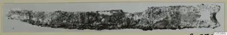 Corroded iron knife blade from Amathus, photographed horizontally on a grey card mount
