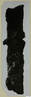 Corroded iron tool from Amathus, long and narrow, shown as a mounted photograph.
