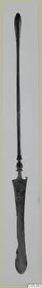 Bronze toilet implement: a long slender rod with a knob and a flat, widened blade end, shown upright.