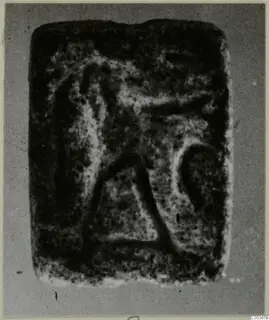 Stone seal from Amathus with a worn engraved design, shown face-on