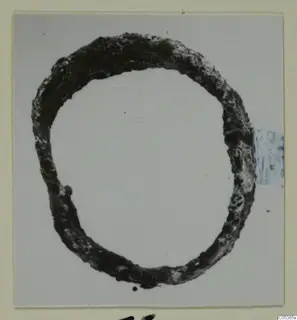 Corroded bronze ring fragment from Amathus, shown on a pale background