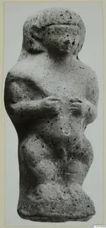 Terracotta figurine of a standing figure with arms bent across the body, from the Amathus tomb finds