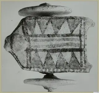 Painted terracotta object from Amathus with a head-like projection, shown on a stand