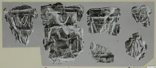 Six crumpled, thin metal-like fragments from Amathus, arranged on a grey backing card.