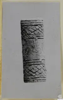 Cylindrical bone object with incised cross-hatched bands and ribbed grooves, from Amathus