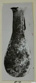 Blown glass vessel from Amathus with a long narrow neck, flared rim and rounded teardrop body