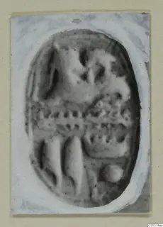 Oval glyptic seal from Amathus with a carved surface, photographed close up