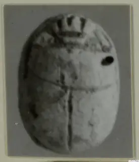 Oval scarab from Amathus with pattern decoration, photographed on a grey card