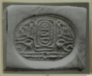 Glyptic find from Amathus: oval design in relief on a pale rectangular block
