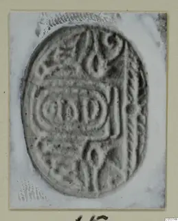 Oval engraved seal from Amathus, photographed on a pale card mount