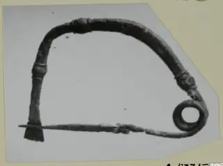Bronze object from Amathus with an arched bow and a coiled spring at one end