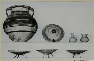 Pottery from Amathus, Tomb 3: a large two-handled jar, a dish, two small jugs and three bowls on metal stands.