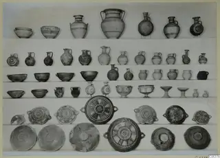 Pottery vessels from Amathus, Tomb 7, second burial, arranged in rows on white cloth
